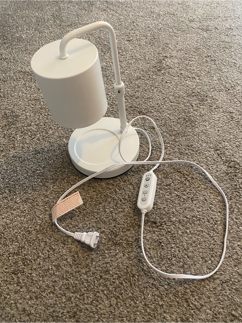 White Adjustable candle warmer with hour and dimness Control.
